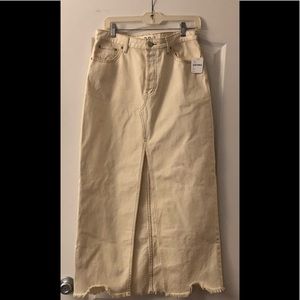 Free People denim skirt with front split. Size 29. New with tags, never worn.